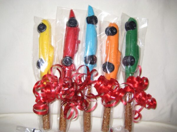 12 race car chocolate-covered pretzel rods tied with red ribbon bows.