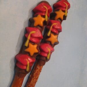 12-Graduation Chocolate Covered Pretzel Rods With Caps and Stars