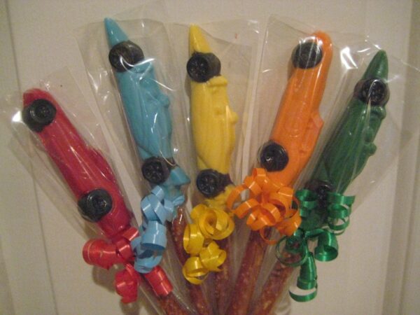 12-Race Car Chocolate Covered Pretzel Rods: Car-shaped chocolates on pretzel sticks, wrapped in clear plastic with decorative ribbons.