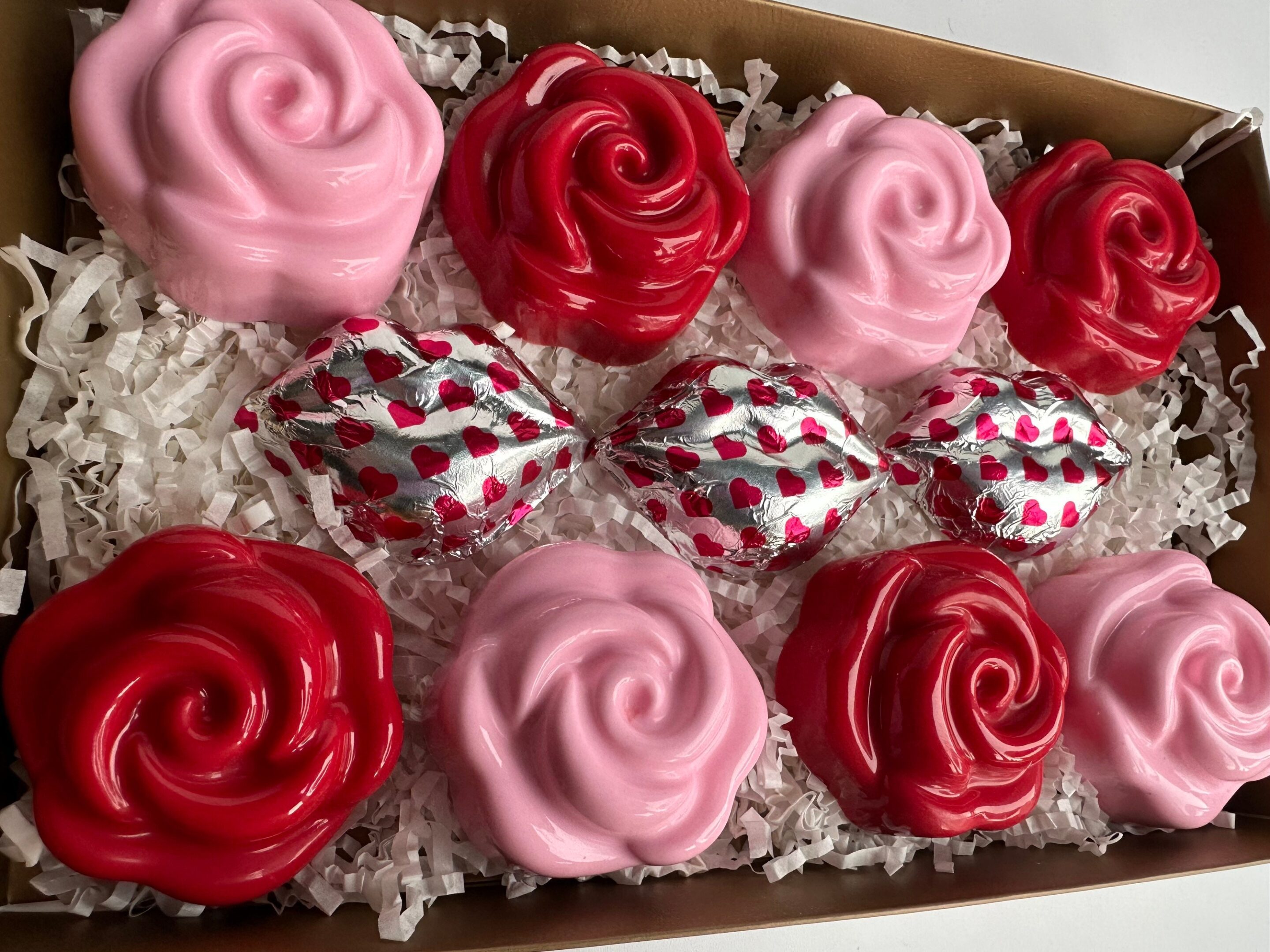 The box includes pink and red rose-shaped soaps along with heart-patterned foil-wrapped 8-Chocolate Covered Oreo Roses for an Anniversary, Birthday, or Valentine Gift Box on shredded paper.