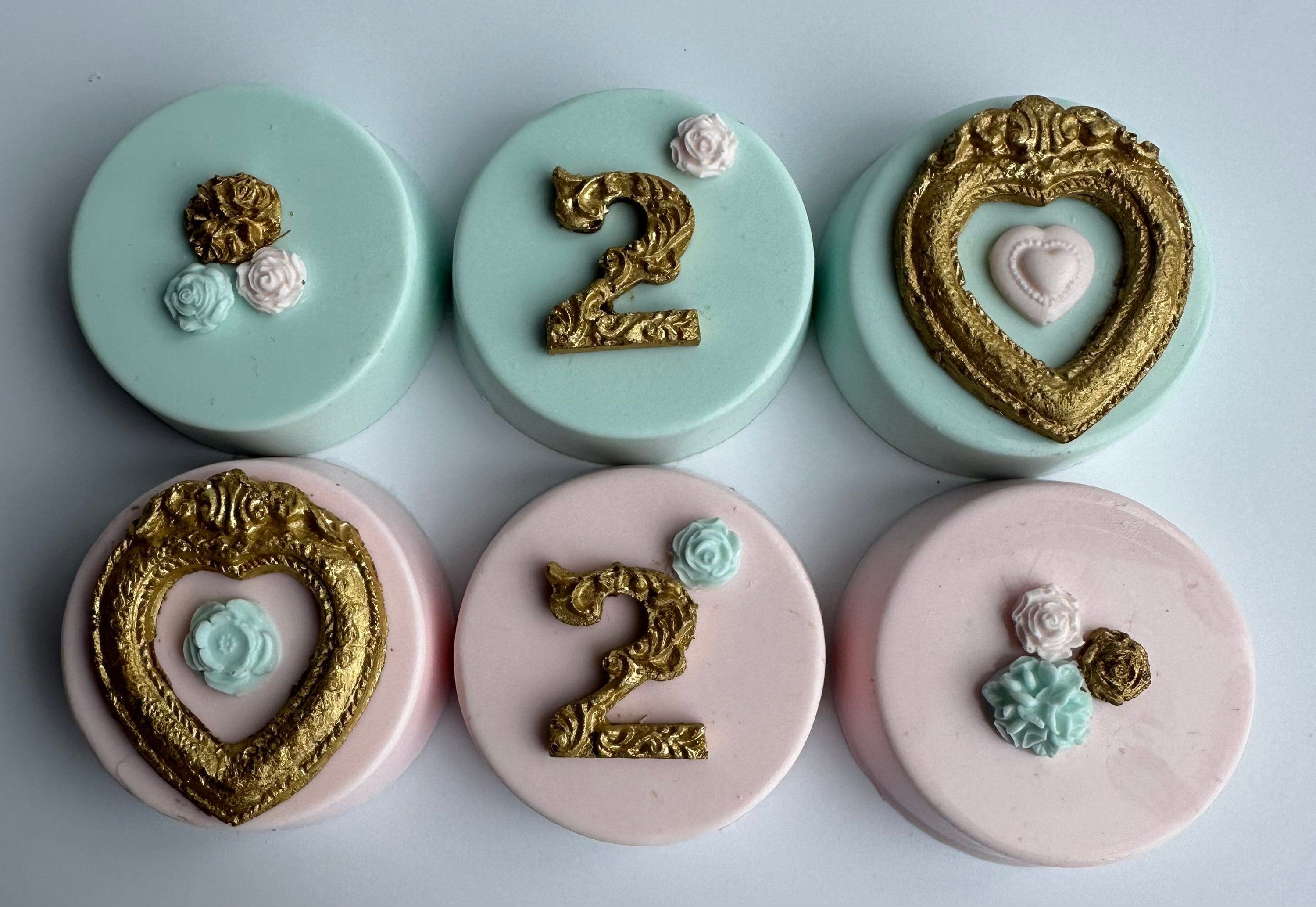 Five round cakes with mint and pink fondant, gold numbers or heart frames, and small rose decorations, inspired by 12-Gold Frame Chocolate Covered Oreos.