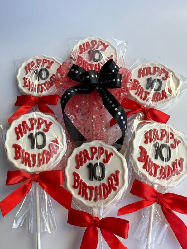 Six chocolate lollipops with "Happy 10 Birthday" text and red bows, one featuring lace and a polka dot bow, set against a white background.