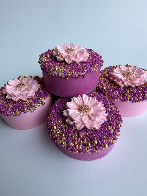 Four fuchsia and pink chocolate-covered Oreos adorned with decorative beads, perfect for weddings, showers, or birthdays.