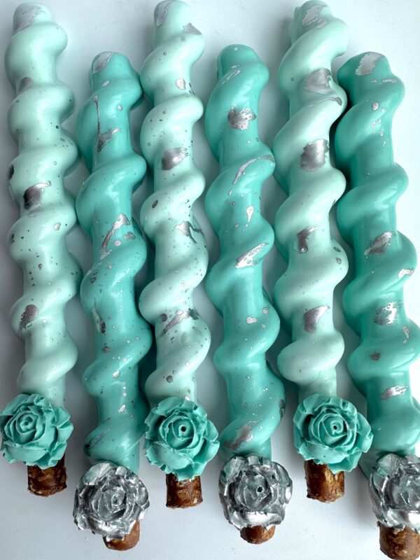 Tiffany Blue and silver chocolate-covered caramel pretzels with teal and white icing, enhanced with silver accents and decorative roses. Perfect for weddings, showers, birthdays, or party favors.