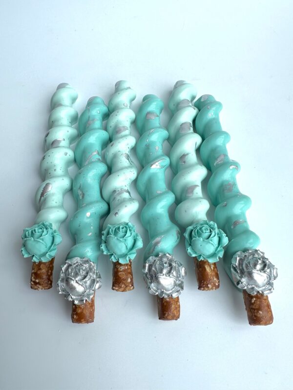 Six Tiffany Blue pretzel sticks coated in blue and white chocolate, accented with silver and decorative flowers for weddings, showers, or parties.