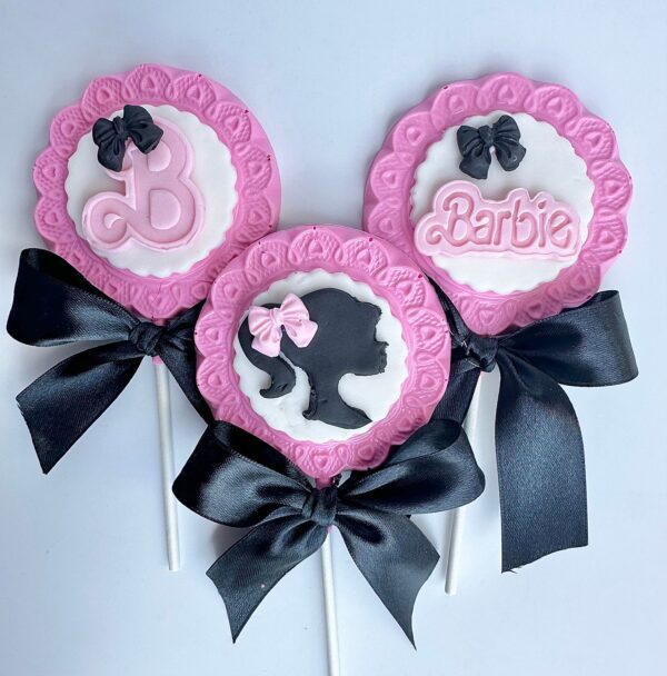This set includes three lollipops with Barbie-themed designs like silhouettes and text, in pink, white, and black bows.