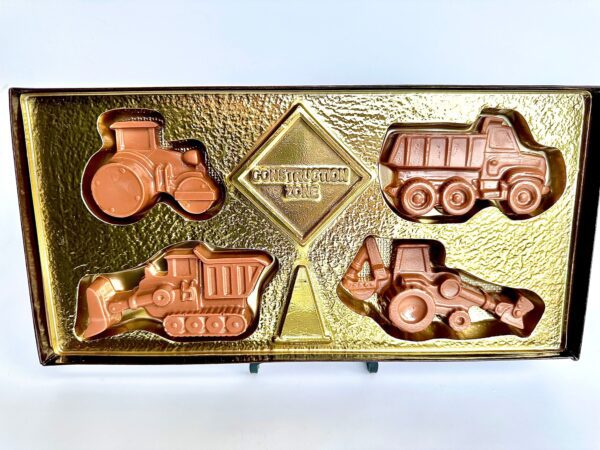 A Construction Trucks Chocolate Gift Box featuring chocolate shapes of construction vehicles in a decorative gold cardboard box, ideal for Father's Day, birthdays, or any occasion.