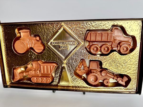 A gift box of vehicle-shaped construction-themed chocolates with a sign and gold-colored backing, titled "Construction Trucks Chocolate Gift Box For Father’s Day/Dad Birthday Gift/Any Occasion/Birthday Gift/Kids Gift.