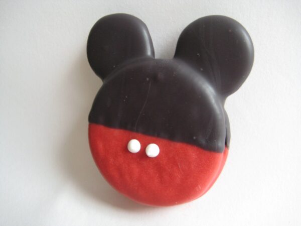 A cookie resembling a mouse head, featuring black ears and top, red base, and two white dots is described in the product: "12-Mickey Mouse Chocolate Covered Oreos.