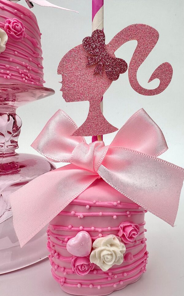 Barbi chocolate jumbo marshmallow with a glittery silhouette topper, adorned with a large pink bow, small flowers, and a heart for themed parties.