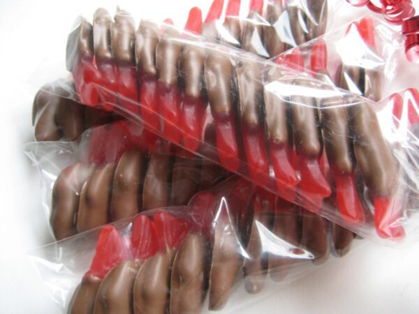 Plastic bags with 24-Chocolate Covered Swedish Fish Favors.