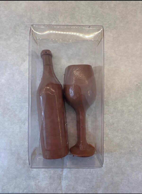 12-Chocolate Wine Glasses and Wine Bottles in a clear favor box on a light gray surface.