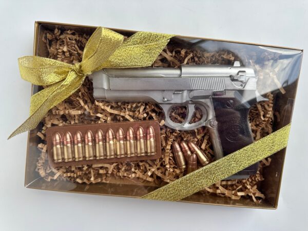 A Chocolate Hand Piece displayed in a gift box, embellished with a gold ribbon, includes ammunition and is an ideal birthday gift for dads, sons, or police officers.
