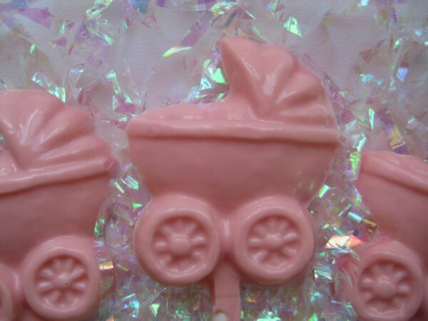 12 chocolate baby carriage lollipops with an iridescent background, perfect for a baby girl shower.