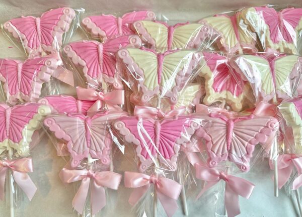Pink and white butterfly lollipops wrapped in clear plastic with pink ribbon bows from the "12-Pretty in Pink Butterfly Lollipops For Birthday Party/Shower Favors/Gift/Garden Party/Baby Girl" collection.