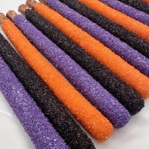 Colorful sugar-coated pretzel rods on display.