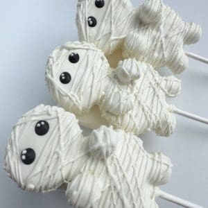 Mummy-themed cake pops with white icing.