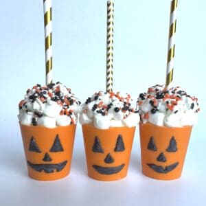 Halloween-themed treats with straws and sprinkles.